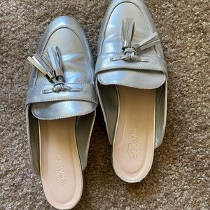 Tilly’s silver tassel mules